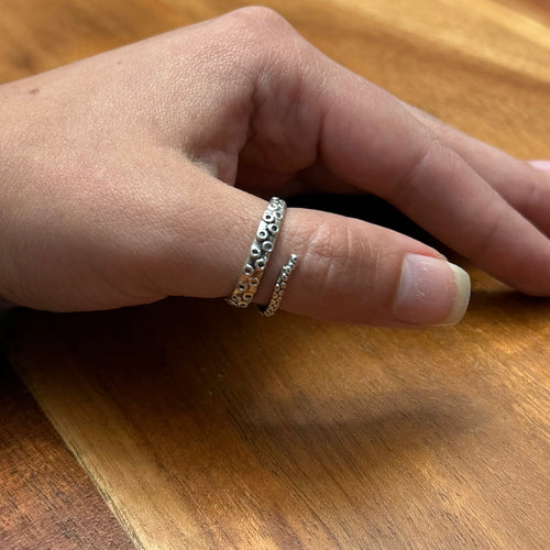 Octopus thumb ring worn on hand