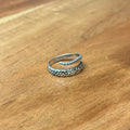 Octopus thumb ring on wooden surface
